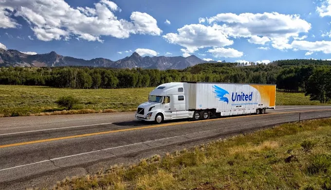 United Semi Truck driving with mountain background