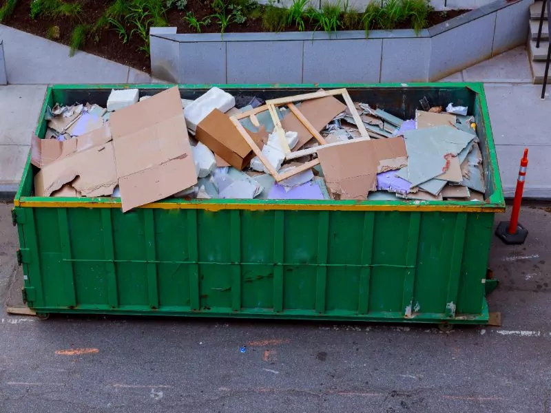 construction waste in an metal container