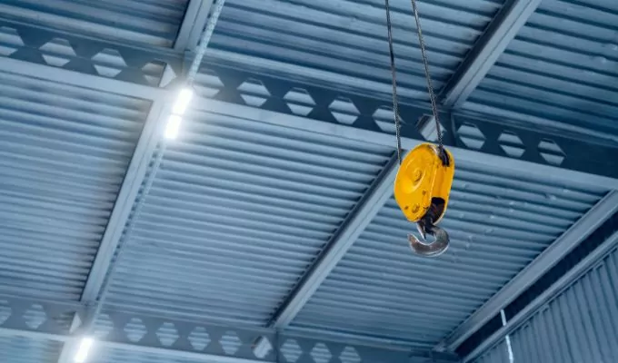 industrial crane hook in a modern factory building