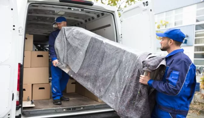 workers loading furniture